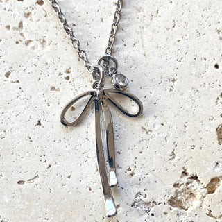 Melted ribbon bow charm necklace: silver